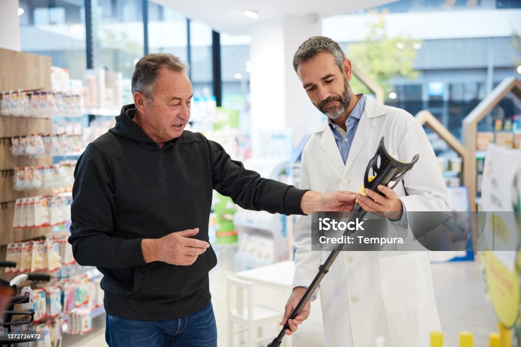 Friendly team member helping a senior couple