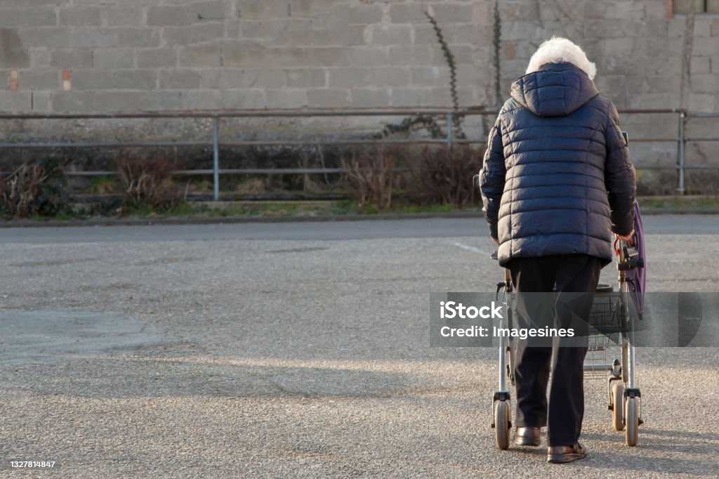 Senior woman relaxing in a lift chair while using a tablet