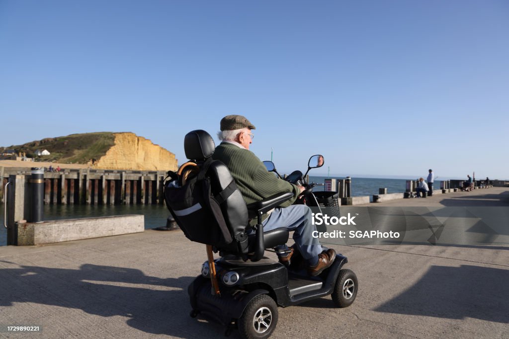 Senior woman relaxing in a lift chair while using a tablet